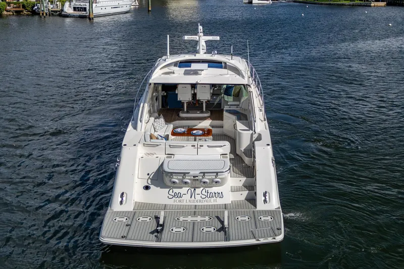 Slide: The Image of 2012 Sea Ray 540 Sundancer yacht on water, rear view, luxury boat. - 4