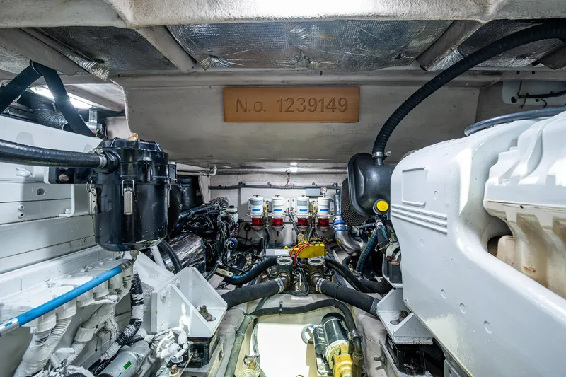 Slide: The Image of Engine room of 2012 Sea Ray 540 Sundancer yacht, showcasing mechanical components and systems. - 44