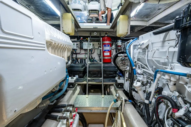 Slide: The Image of Engine room of 2012 Sea Ray 540 Sundancer yacht, featuring mechanical equipment and fire extinguisher. - 45
