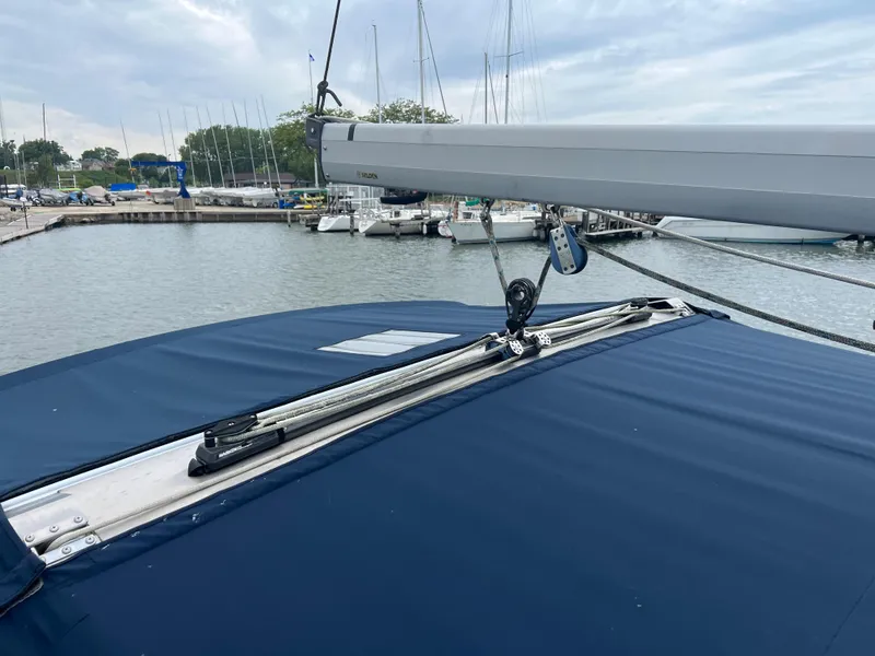 Slide: The Image of Sailboat Hunter 410 (2000) with blue cover docked at marina. - 12