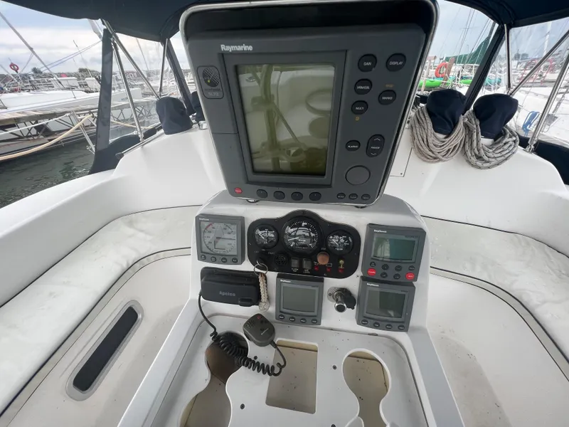 Slide: The Image of Cockpit of 2000 Hunter 410 sailboat with navigation instruments and controls. - 24