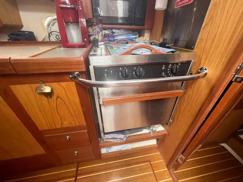 Slide: The Image of Wooden boat kitchen with stainless steel oven, Hunter 410 model, year 2000. - 38