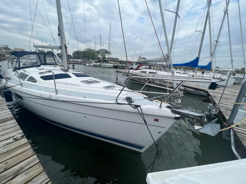 Slide: The Image of Sailboat docked at marina, 2000 Hunter 410 model, overcast sky. - 6