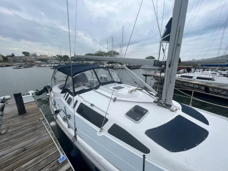 Slide: The Image of Sailboat docked at marina, Hunter 410 model, year 2000, overcast sky. - 8