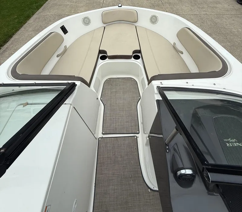 Slide: The Image of 2018 Bayliner VR6 Bowrider I/O interior with beige seating and open deck layout. - 13