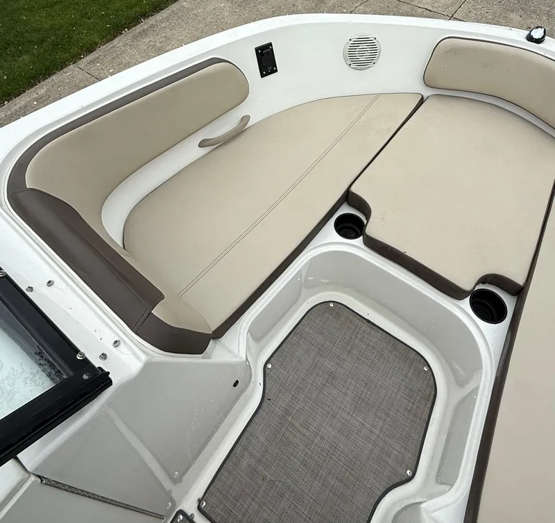 Slide: The Image of 2018 Bayliner VR6 Bowrider I/O interior with beige seating and cup holders. - 15