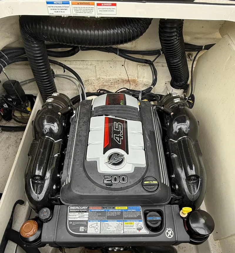 Slide: The Image of 2018 Bayliner VR6 Bowrider I/O engine compartment with 4.5L 200 HP MerCruiser engine. - 16