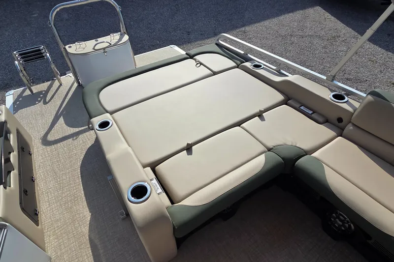 Slide: The Image of 2025 Avalon Platinum LSZ 2585 Versatile Rear Bench with beige seating and cup holders. - 9