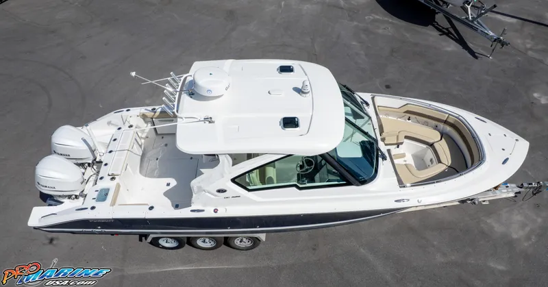 Slide: The Image of 2021 Pursuit DC 326 Dual Console boat with twin engines, aerial view. - 26