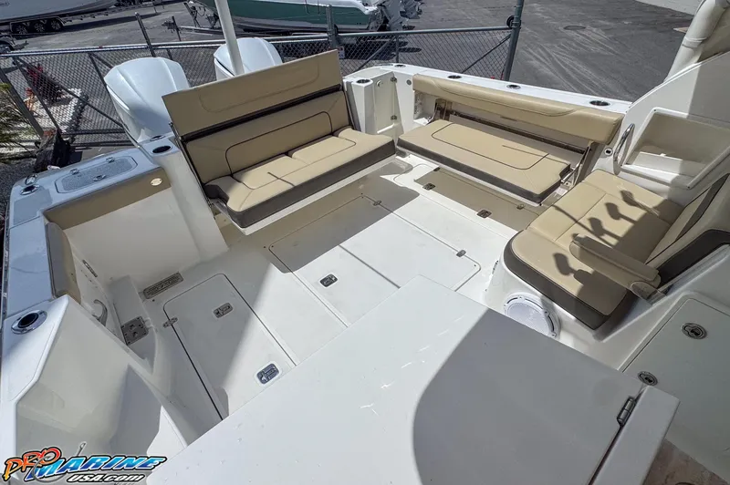 Slide: The Image of 2021 Pursuit DC 326 Dual Console boat with spacious seating and storage. - 32