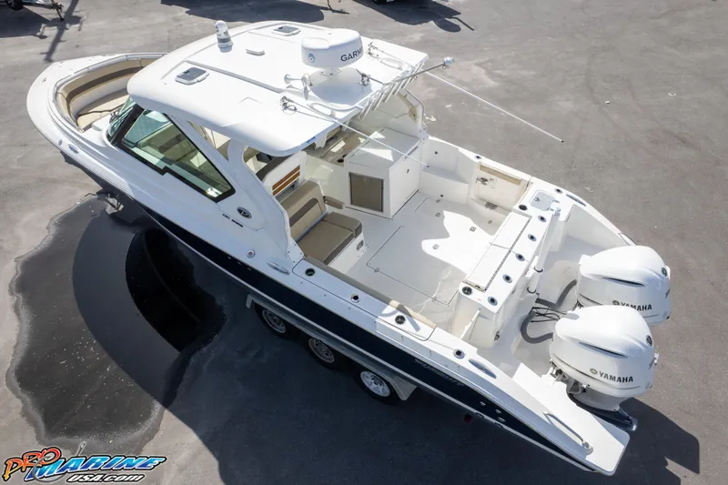 Slide: The Image of 2021 Pursuit DC 326 Dual Console boat with twin Yamaha engines, aerial view. - 4