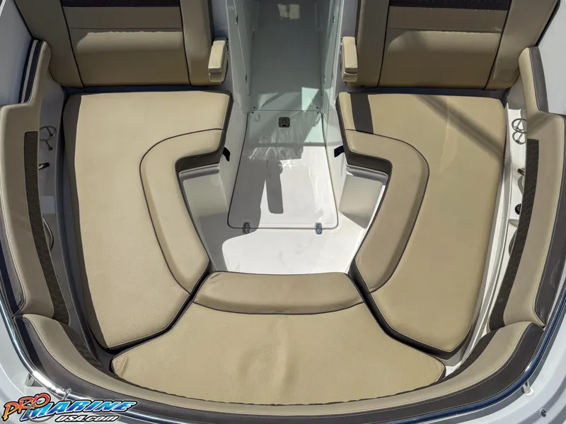 Slide: The Image of 2021 Pursuit DC 326 Dual Console boat interior with beige cushioned seating. - 44