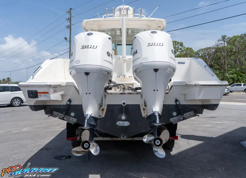 Slide: The Image of 2021 Pursuit DC 326 Dual Console boat with twin Yamaha 300 engines, rear view. - 7