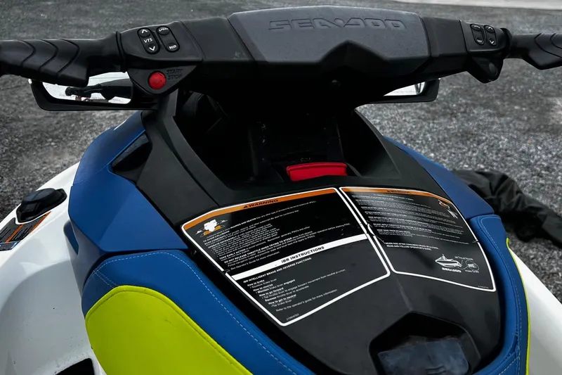 Slide: The Image of 2017 Sea-Doo Wake Pro 230 dashboard with controls and safety instructions. - 6