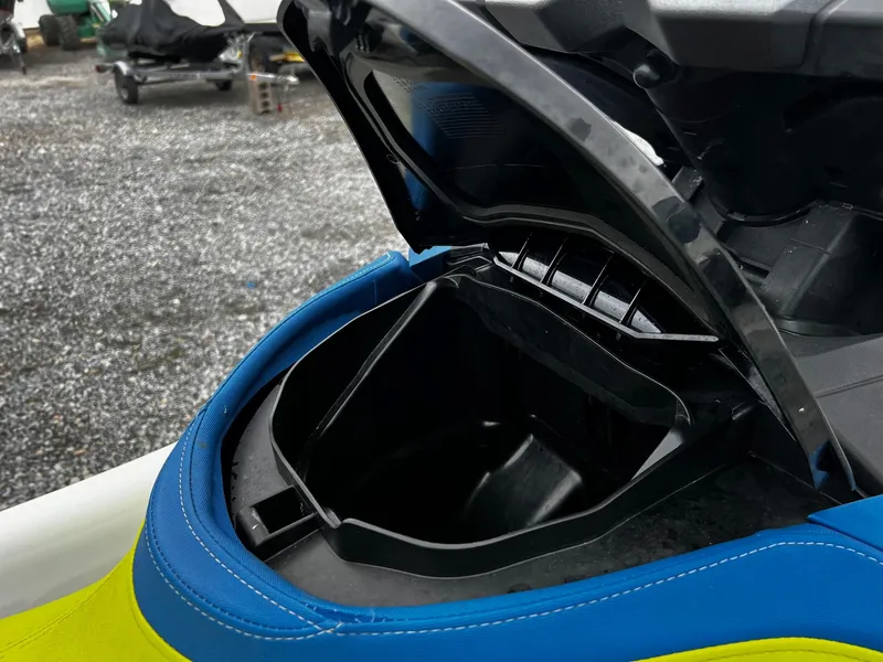 Slide: The Image of 2017 Sea-Doo Wake Pro 230 storage compartment open, showcasing interior space. - 7