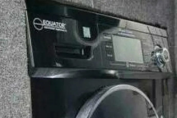 Slide: The Image of Washing machine in a 2022 Custom Freestyle Marine 32 boat interior. - 15