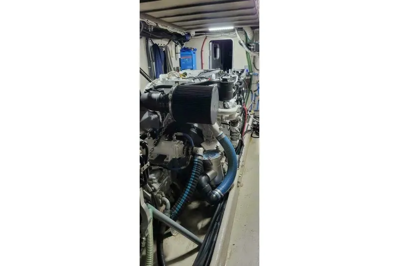 Slide: The Image of Engine room of 2022 Custom Freestyle Marine 32 with visible components and wiring. - 17