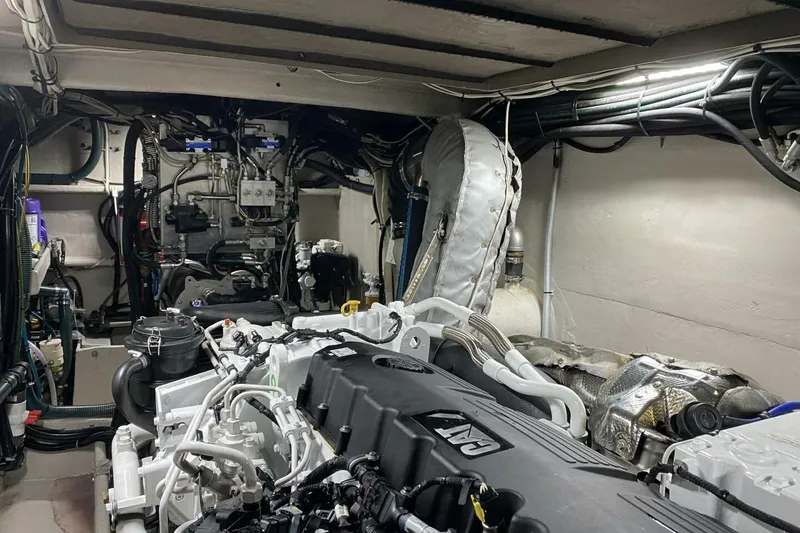 Slide: The Image of Engine room of 2022 Custom Freestyle Marine 32, showcasing complex machinery and wiring. - 18
