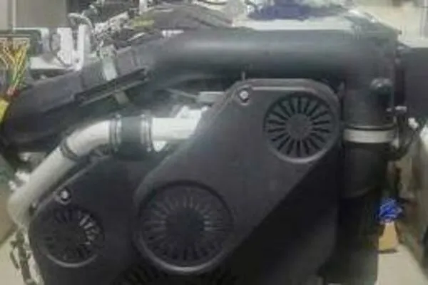 Slide: The Image of Engine of a 2022 Custom Freestyle Marine 32 boat, showcasing intricate mechanical components. - 19