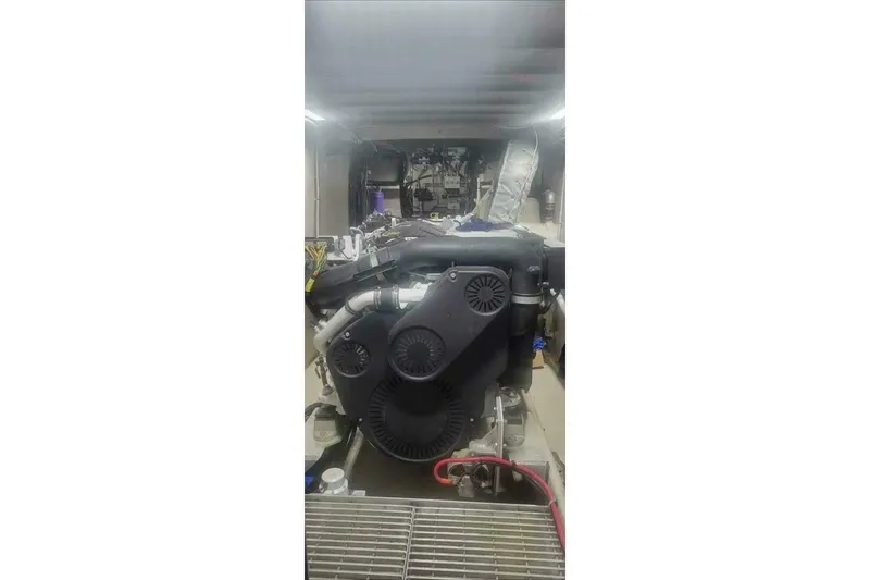 Slide: The Image of Engine room of 2022 Custom Freestyle Marine 32 boat, showcasing mechanical components. - 22