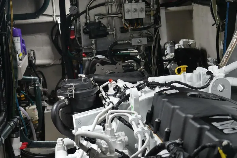 Slide: The Image of Engine room of 2022 Custom Freestyle Marine 32 boat, showcasing complex machinery and components. - 28