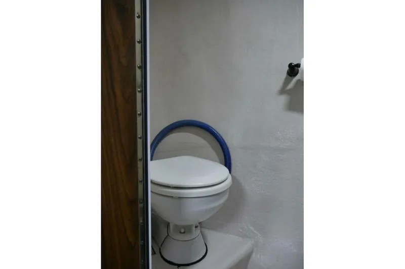 Slide: The Image of Marine toilet in 2022 Custom Freestyle Marine 32 boat bathroom. - 31
