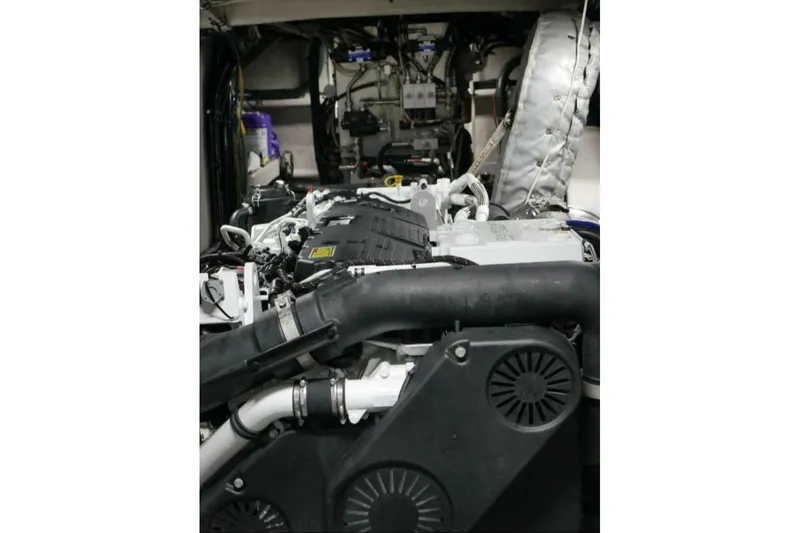 Slide: The Image of Engine room of 2022 Custom Freestyle Marine 32 boat, showcasing complex machinery and components. - 32