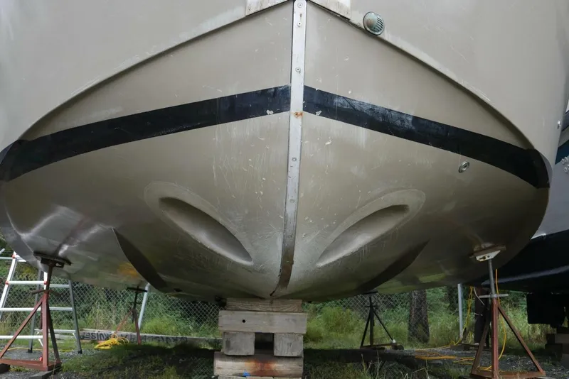 Slide: The Image of Bottom view of a 2022 Custom Freestyle Marine 32 boat on dry dock. - 4