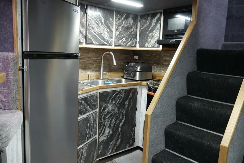 Slide: The Image of Modern kitchen interior in 2022 Custom Freestyle Marine 32, featuring sleek appliances and stylish cabinetry. - 41