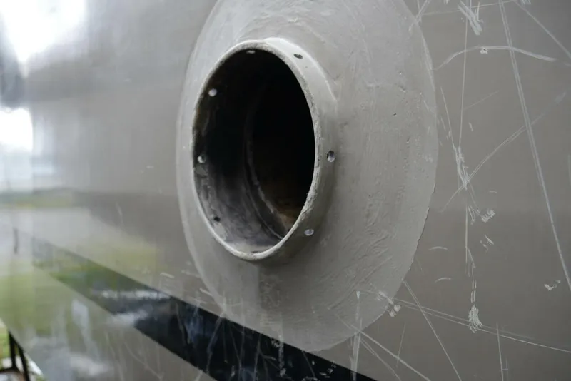 Slide: The Image of Close-up of a 2022 Custom Freestyle Marine 32 boat hull with a circular opening. - 43