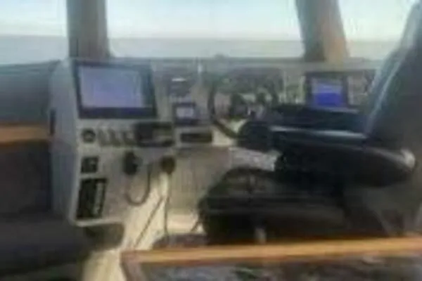 Slide: The Image of Cockpit of 2022 Custom Freestyle Marine 32 boat with navigation equipment. - 44
