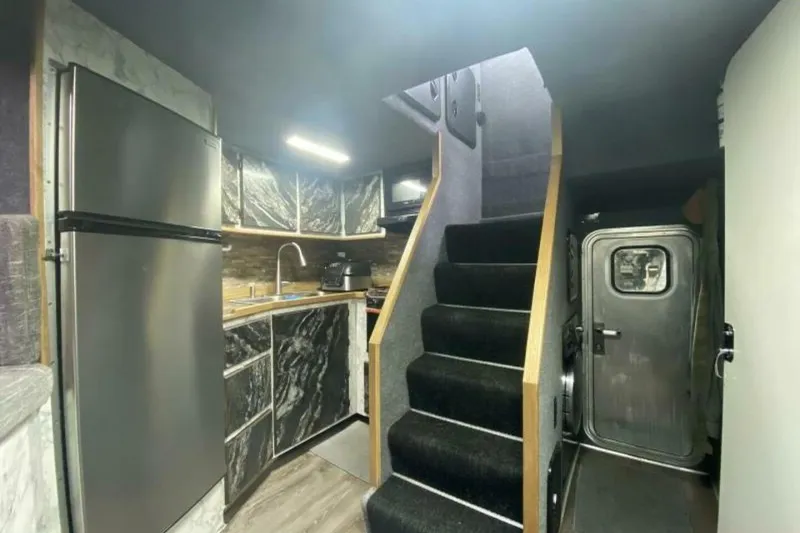 Slide: The Image of Modern kitchen interior in 2022 Custom Freestyle Marine 32 boat, featuring sleek design and stainless steel appliances. - 7