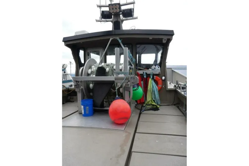 Slide: The Image of Custom Freestyle Marine 32 boat deck with equipment and colorful buoys, 2022 model. - 9