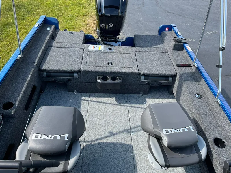 Slide: The Image of 2026 Lund 1675 Adventure Sport boat interior with seating and storage compartments. - 10