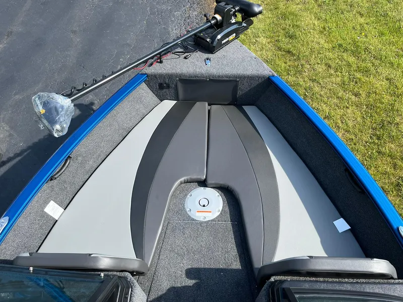 Slide: The Image of 2026 Lund 1675 Adventure Sport boat interior with seating and trolling motor. - 13