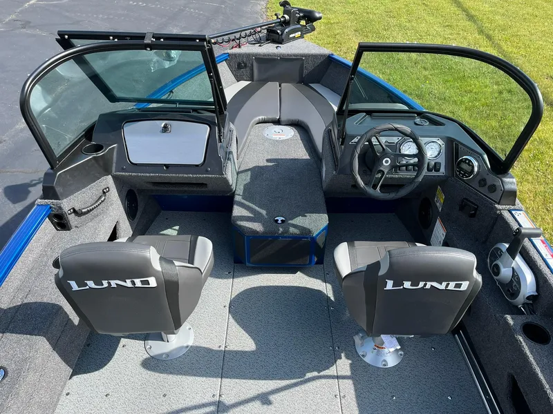 Slide: The Image of 2026 Lund 1675 Adventure Sport boat interior with dual seats and steering console. - 6
