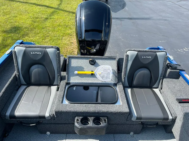 Slide: The Image of 2026 Lund 1675 Adventure Sport boat interior with two seats and storage compartments. - 9