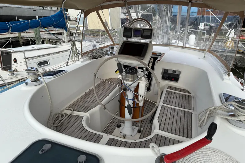 Slide: The Image of Cockpit of 1997 Beneteau Oceanis 40 CC sailboat with steering wheel and navigation equipment. - 10
