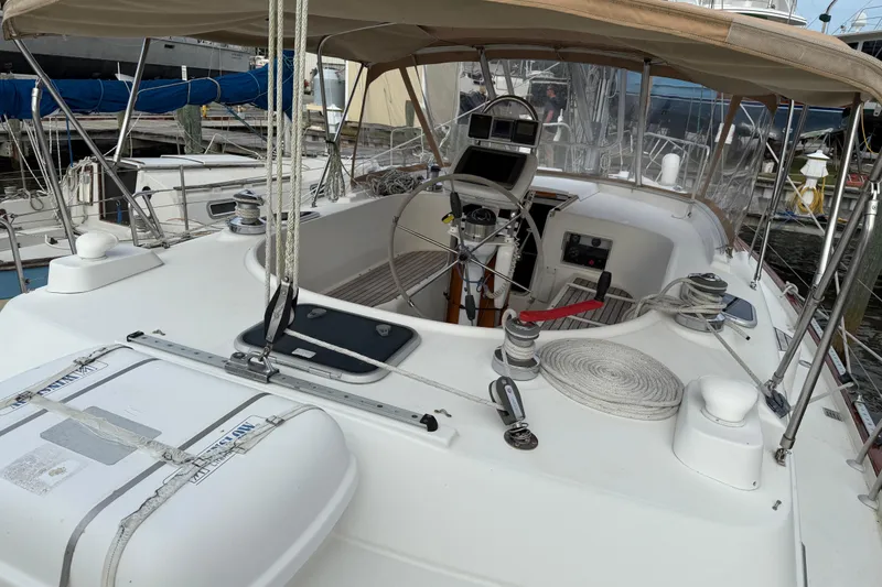 Slide: The Image of 1997 Beneteau Oceanis 40 CC sailboat cockpit with steering wheel and navigation equipment. - 11