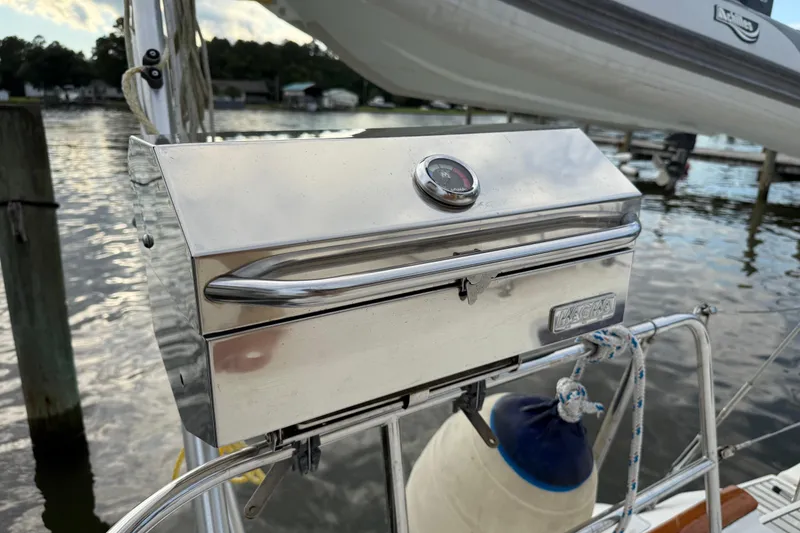 Slide: The Image of Stainless steel grill on 1997 Beneteau Oceanis 40 CC sailboat, docked by the water. - 12