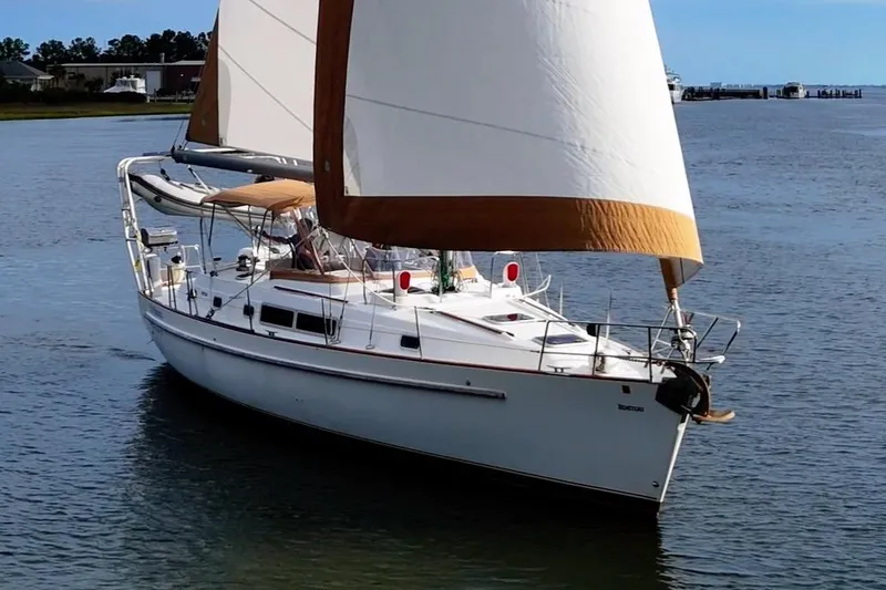 Slide: The Image of 1997 Beneteau Oceanis 40 CC sailboat cruising on calm waters. - 2