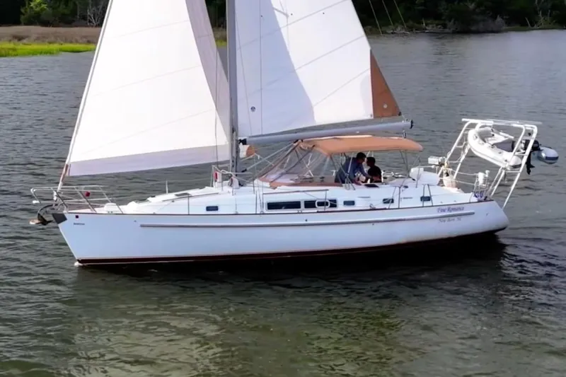 Slide: The Image of 1997 Beneteau Oceanis 40 CC sailboat cruising on calm waters. - 3