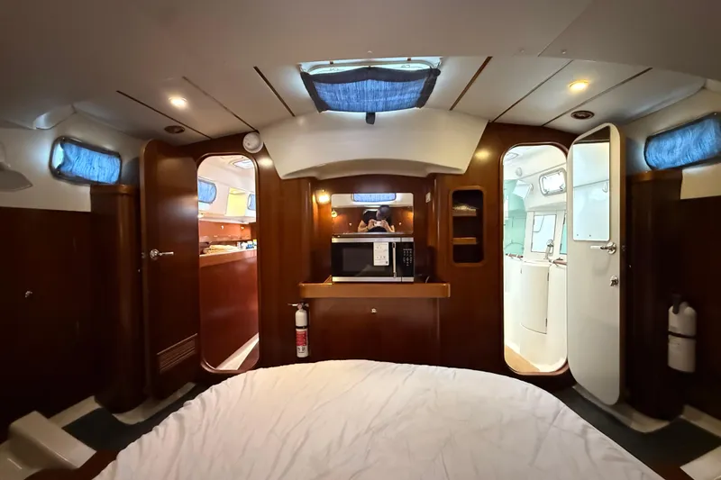 Slide: The Image of Interior of 1997 Beneteau Oceanis 40 CC yacht, featuring cozy cabin and modern amenities. - 32
