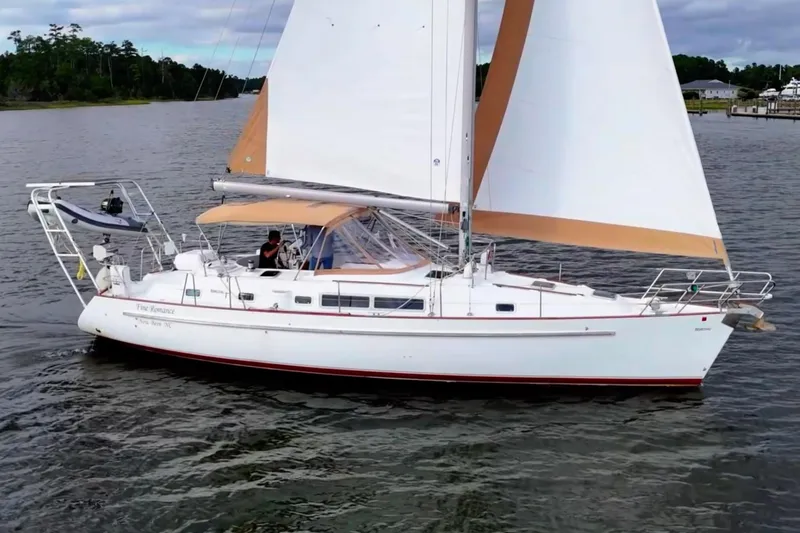 Slide: The Image of 1997 Beneteau Oceanis 40 CC sailboat cruising on calm waters. - 7