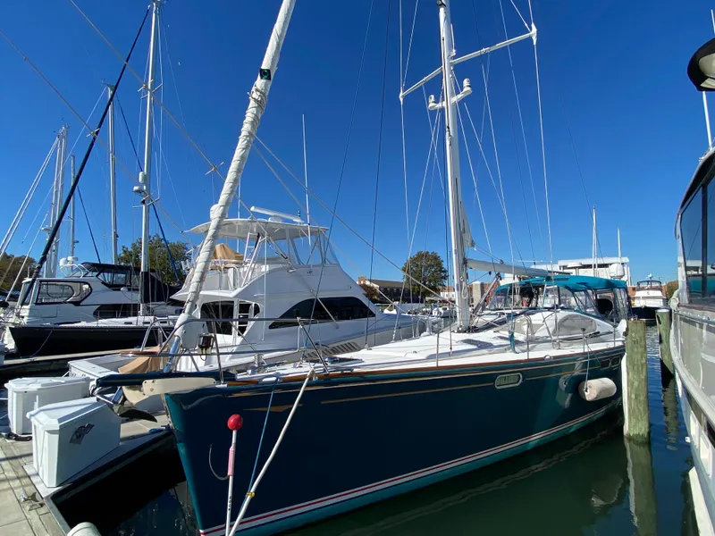 The Image of 2008 Jeanneau Sun Odyssey 54 DS sailboat docked at marina under clear blue sky. - 0