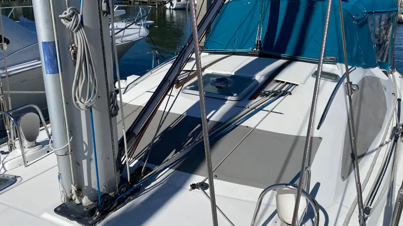 Slide: The Image of 2008 Jeanneau Sun Odyssey 54 DS sailboat deck with rigging and blue canopy. - 14