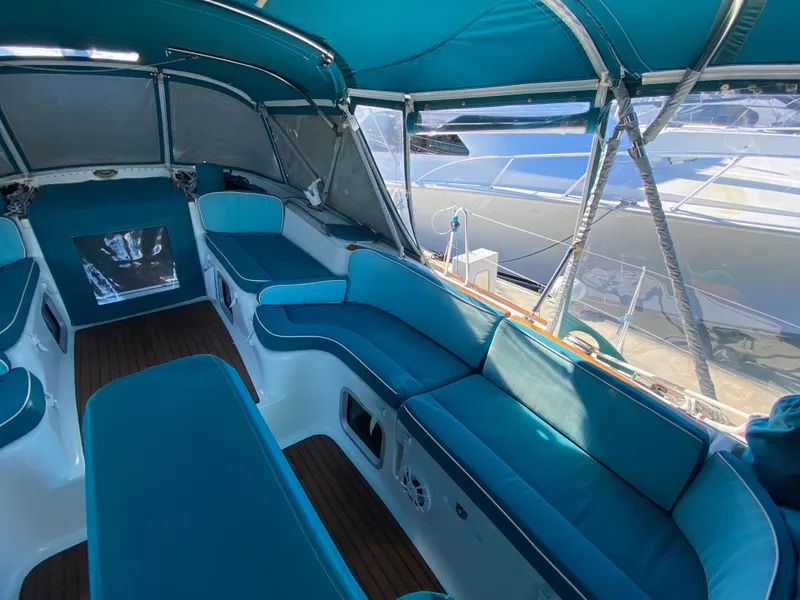 Slide: The Image of Interior of 2008 Jeanneau Sun Odyssey 54 DS sailboat with blue seating and canopy. - 20