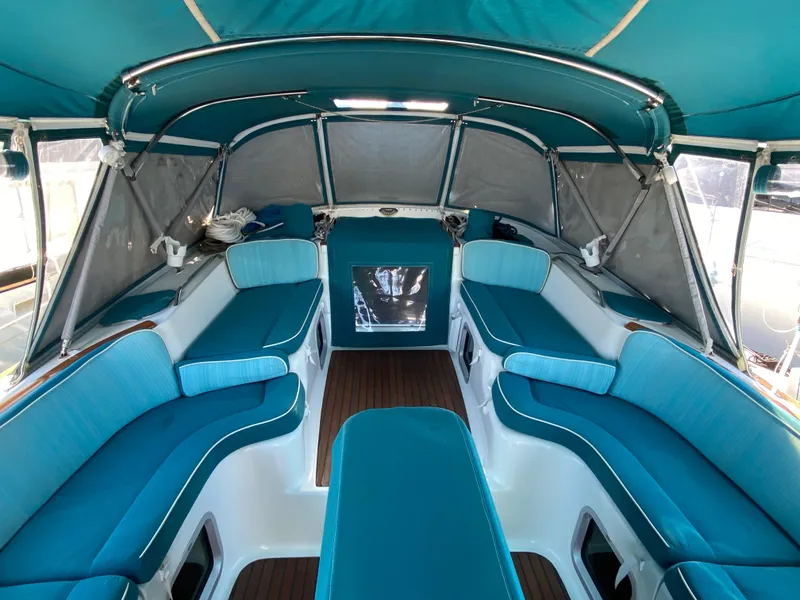 Slide: The Image of Interior of 2008 Jeanneau Sun Odyssey 54 DS sailboat with blue seating and canopy. - 21