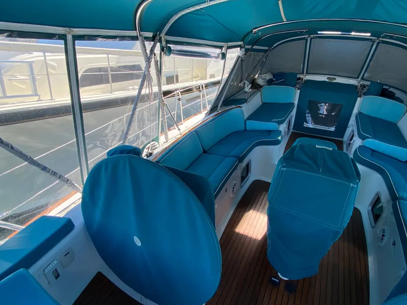 Slide: The Image of 2008 Jeanneau Sun Odyssey 54 DS cockpit with blue seating and canopy. - 23