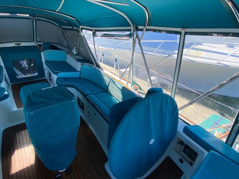 Slide: The Image of Interior of 2008 Jeanneau Sun Odyssey 54 DS sailboat with blue seating and canopy. - 24